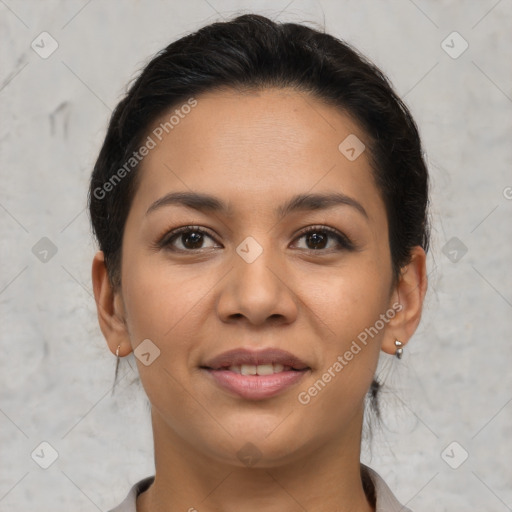 Joyful latino young-adult female with short  brown hair and brown eyes