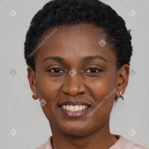 Joyful black young-adult female with short  black hair and brown eyes