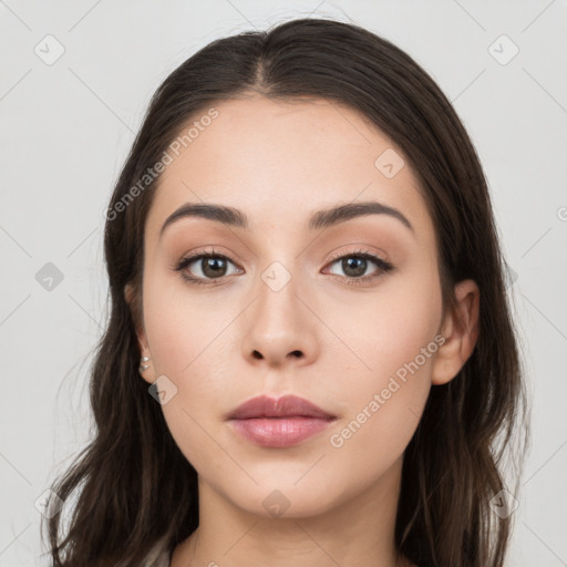 Neutral white young-adult female with long  brown hair and brown eyes