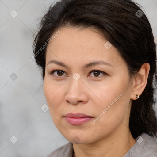 Joyful white adult female with medium  brown hair and brown eyes