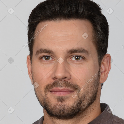 Joyful white adult male with short  brown hair and brown eyes