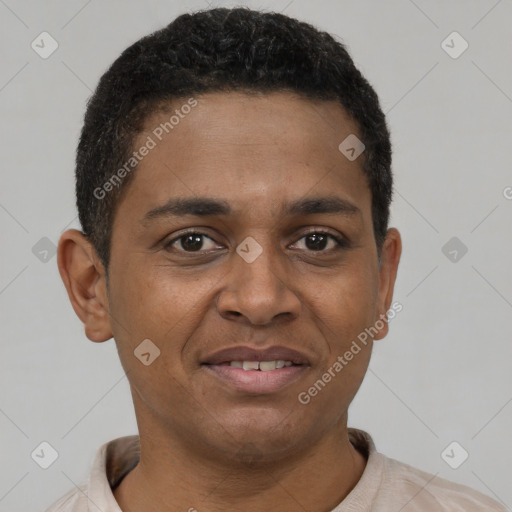 Joyful black young-adult male with short  brown hair and brown eyes