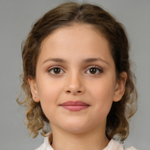 Joyful white child female with medium  brown hair and brown eyes