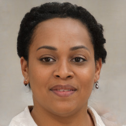 Joyful black young-adult female with short  brown hair and brown eyes