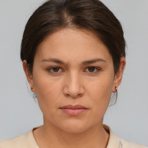 Neutral white young-adult female with short  brown hair and brown eyes