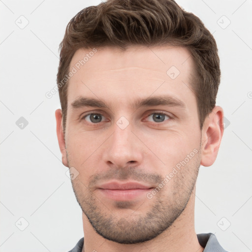 Neutral white young-adult male with short  brown hair and grey eyes