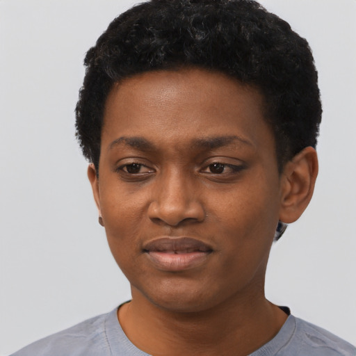 Joyful black young-adult female with short  black hair and brown eyes