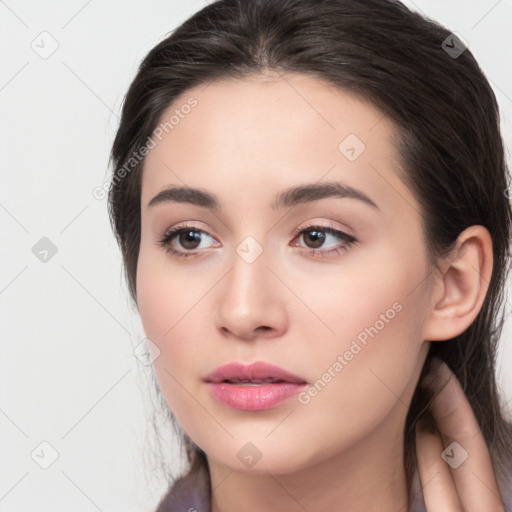 Neutral white young-adult female with long  brown hair and brown eyes