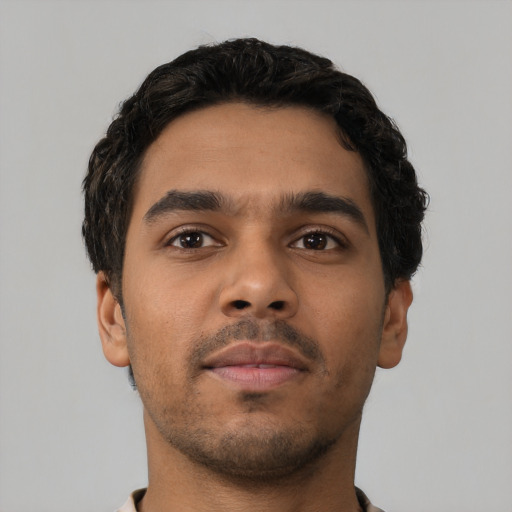 Neutral latino young-adult male with short  brown hair and brown eyes