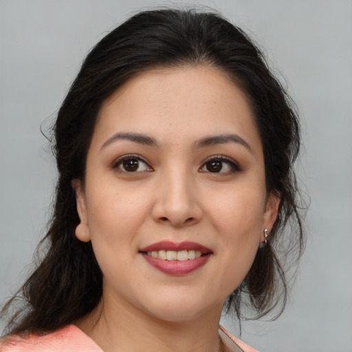 Joyful asian young-adult female with medium  brown hair and brown eyes