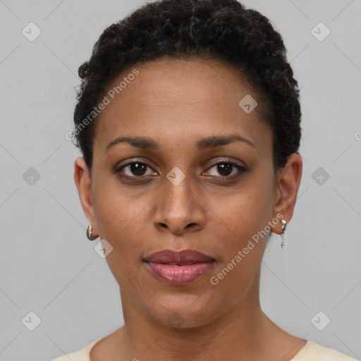 Joyful black young-adult female with short  brown hair and brown eyes