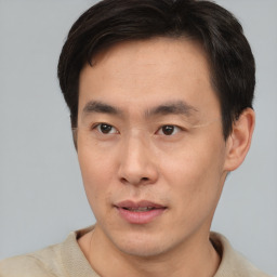 Neutral asian young-adult male with short  brown hair and brown eyes