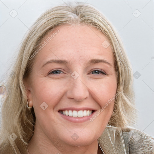 Joyful white young-adult female with long  brown hair and blue eyes