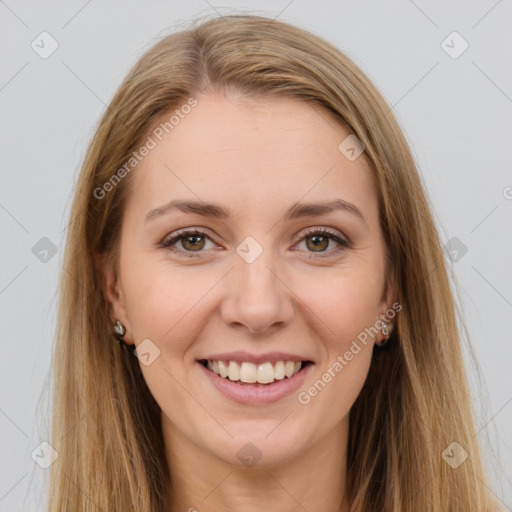 Joyful white young-adult female with long  brown hair and brown eyes