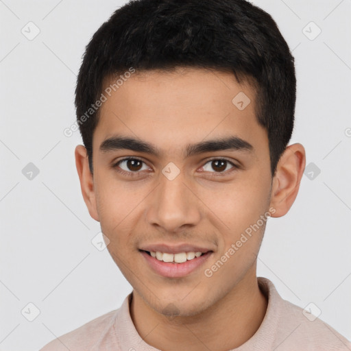 Joyful latino young-adult male with short  brown hair and brown eyes