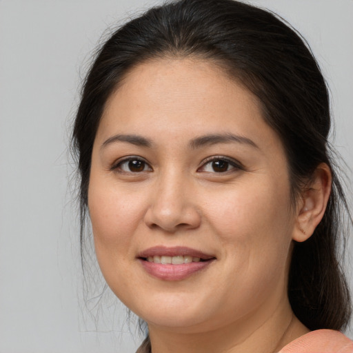 Joyful white young-adult female with long  brown hair and brown eyes