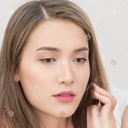 Neutral white young-adult female with long  brown hair and brown eyes