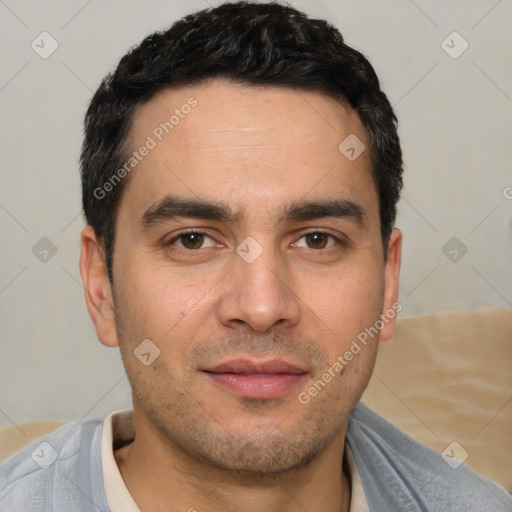 Joyful white young-adult male with short  black hair and brown eyes