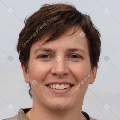 Joyful white young-adult female with short  brown hair and grey eyes