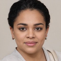 Joyful latino young-adult female with short  brown hair and brown eyes