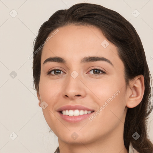 Joyful white young-adult female with medium  brown hair and brown eyes