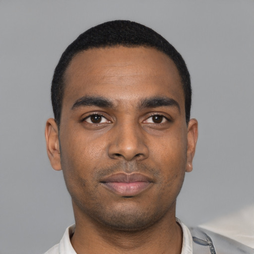 Neutral black young-adult male with short  black hair and brown eyes