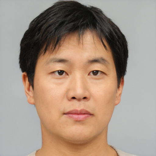 Neutral asian young-adult male with short  brown hair and brown eyes