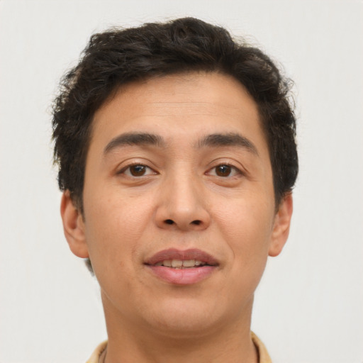 Joyful asian young-adult male with short  brown hair and brown eyes