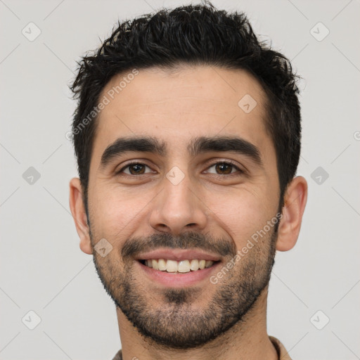 Joyful white young-adult male with short  black hair and brown eyes