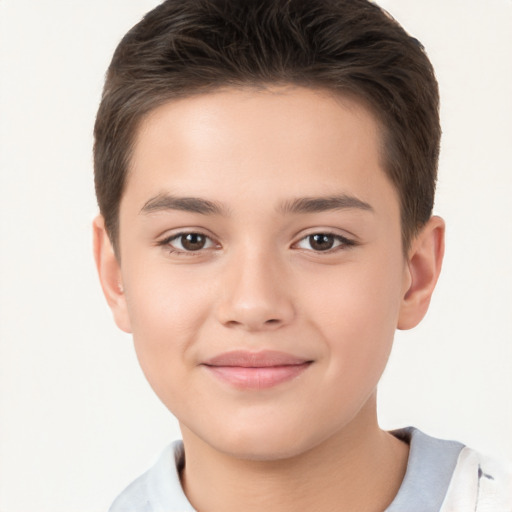 Joyful white child male with short  brown hair and brown eyes