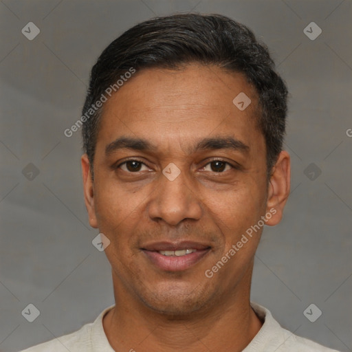 Joyful black adult male with short  black hair and brown eyes