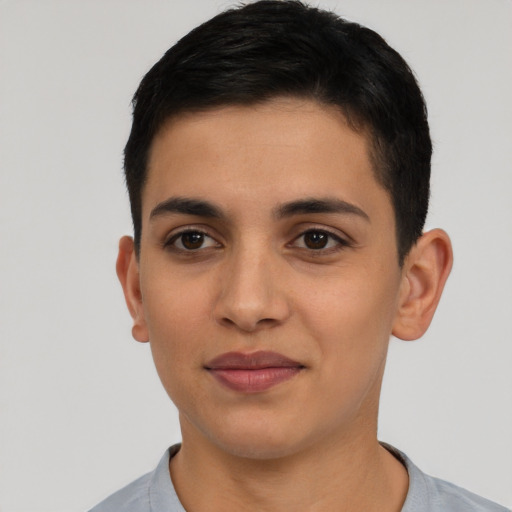Joyful latino young-adult male with short  brown hair and brown eyes