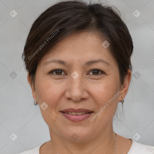 Joyful white adult female with short  brown hair and brown eyes