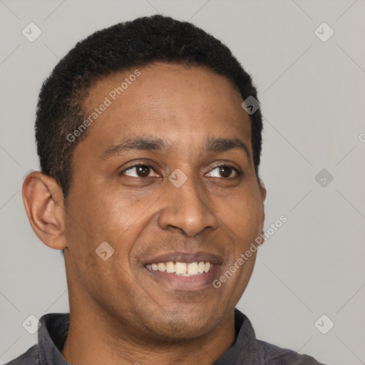 Joyful latino young-adult male with short  brown hair and brown eyes