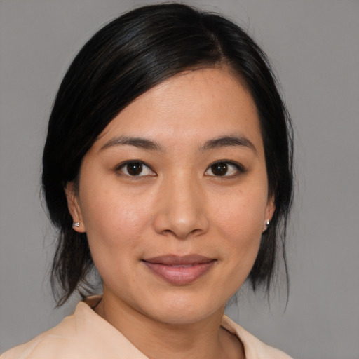 Joyful white young-adult female with medium  black hair and brown eyes
