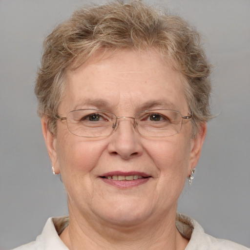 Joyful white middle-aged female with short  brown hair and blue eyes