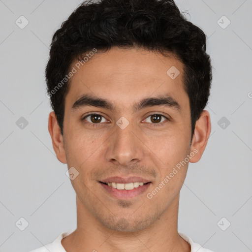 Joyful white young-adult male with short  black hair and brown eyes