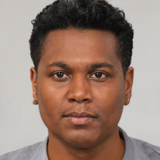 Neutral black young-adult male with short  black hair and brown eyes