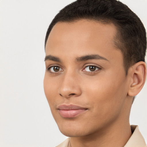 Joyful latino young-adult male with short  brown hair and brown eyes