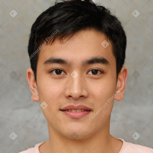 Joyful asian young-adult male with short  brown hair and brown eyes