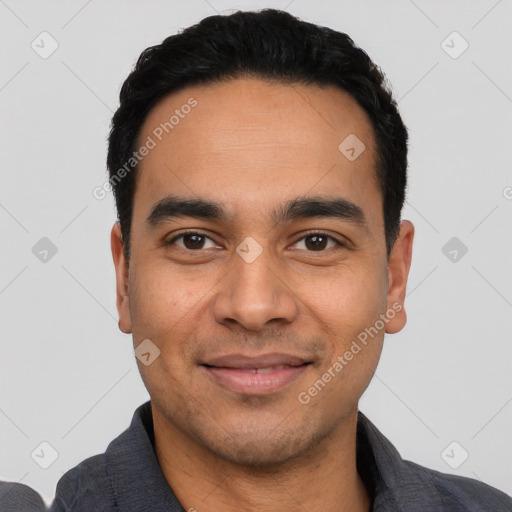 Joyful latino young-adult male with short  black hair and brown eyes