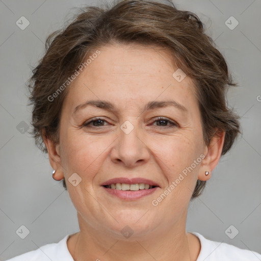 Joyful white adult female with short  brown hair and brown eyes