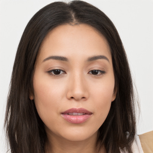 Joyful asian young-adult female with long  brown hair and brown eyes