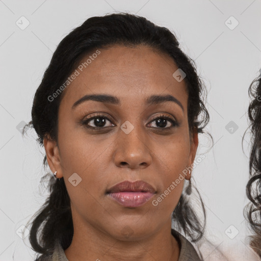 Joyful black young-adult female with medium  brown hair and brown eyes