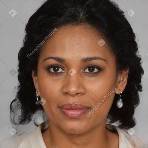 Joyful black adult female with medium  brown hair and brown eyes