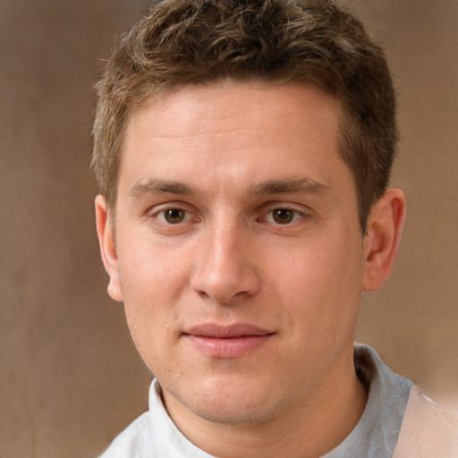 Joyful white young-adult male with short  brown hair and brown eyes