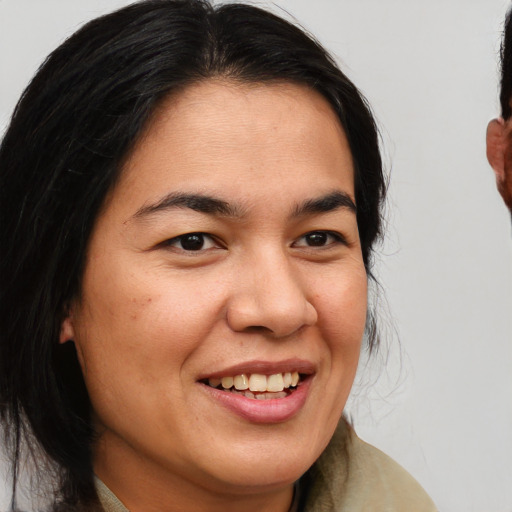 Joyful white young-adult female with medium  brown hair and brown eyes