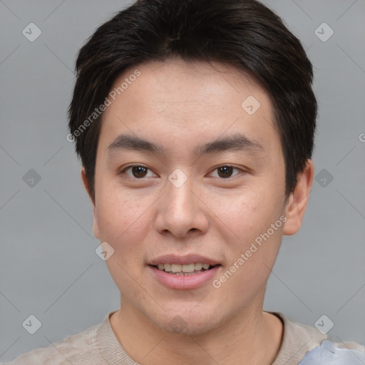 Joyful asian young-adult male with short  brown hair and brown eyes