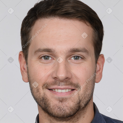 Joyful white young-adult male with short  brown hair and grey eyes