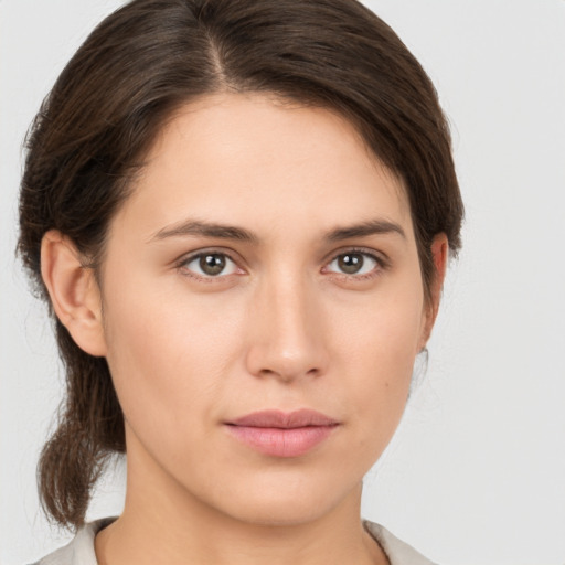 Neutral white young-adult female with medium  brown hair and brown eyes